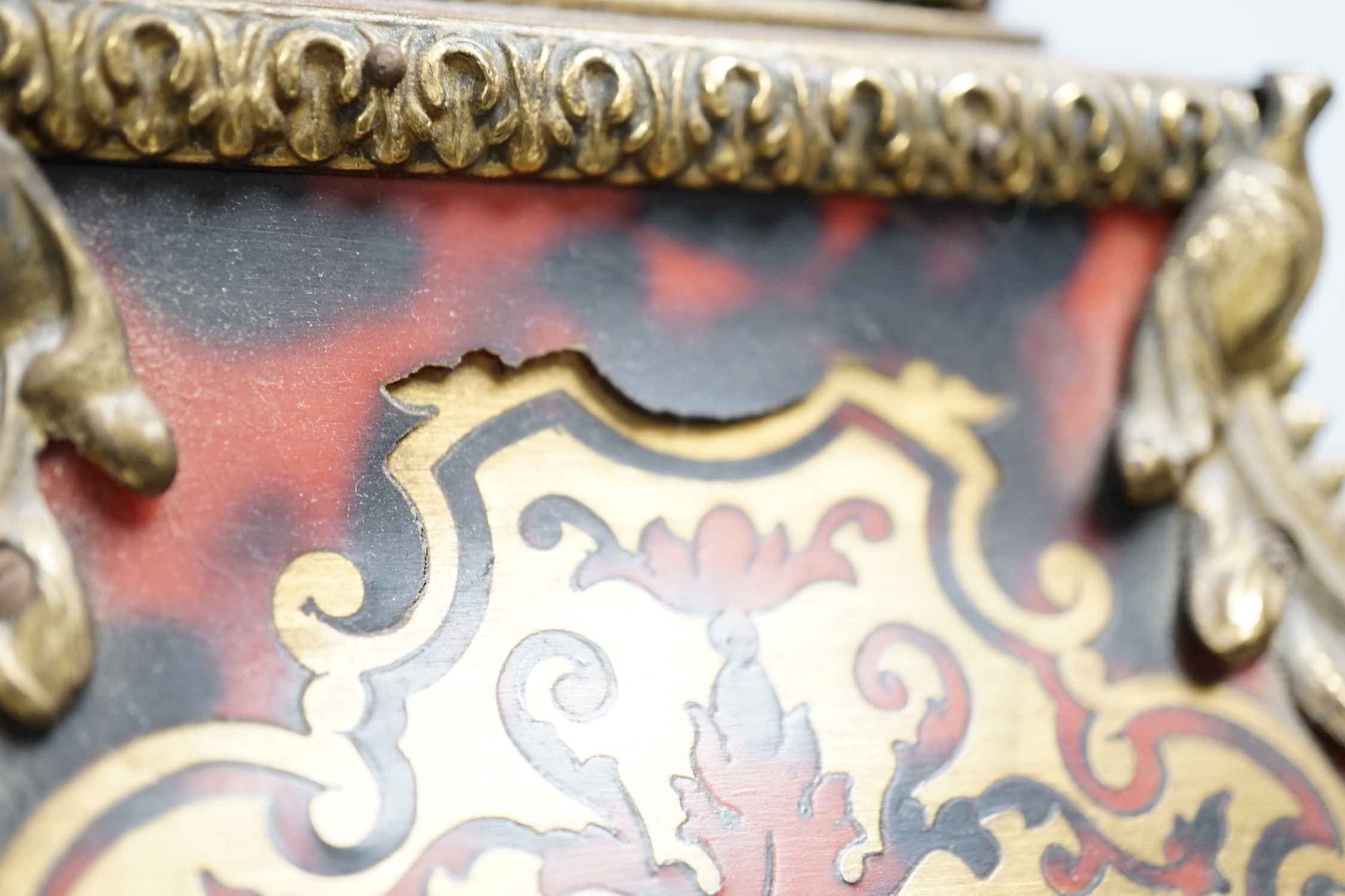 A simulated tortoiseshell Boulle work mantel clock, striking on a bell, 57cm high